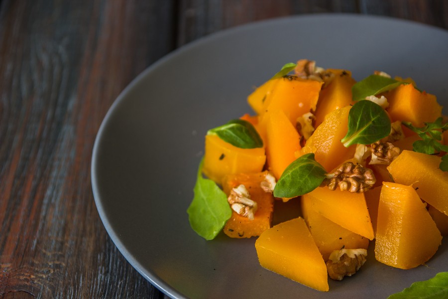 Salad With Pumpkin, Walnuts And Green Leaves